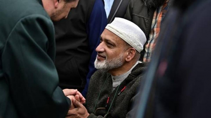 Al Noor mosque shootings survivor Farid Ahmad whose wife Husna was killed, is greeted by a well-wisher in Christchurch on March 17, 2019. | Photo Credit: AFP
